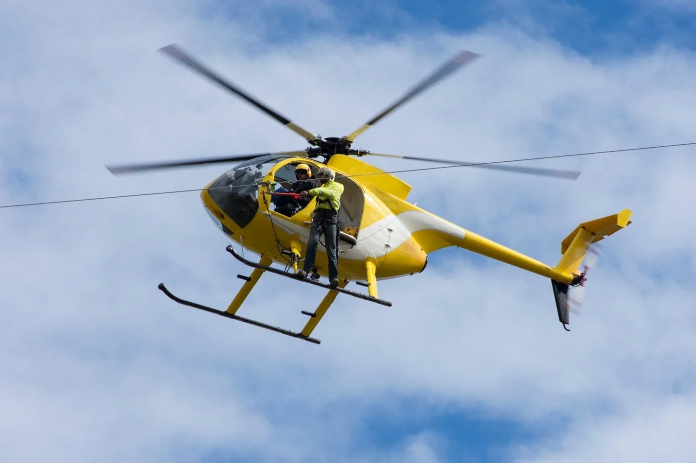 Helicopter crew working power lines